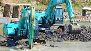 Kobelco SK200 10 Excavators Digging Swinging Rocks From The River [upl. by Ylrac222]