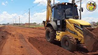 Remoção de material úmido de cima da subbaseRetroescavadeirabackhoe B110B New Holland [upl. by Acinomal]