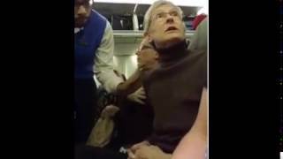 Woman berating Trump fan is kicked off plane  Passengers cheer [upl. by Bartholomeus]