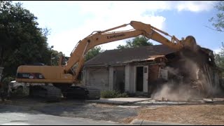 Excavator Destroys House [upl. by Tlihcox]