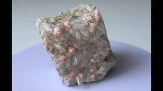 Rhodochrosite spherulites on clear Quartz crystal druse 2 [upl. by Janette]