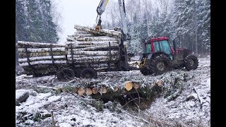 Valtra A93 forestry tractor logging in winter forest large fully loaded trailer [upl. by Aramat84]