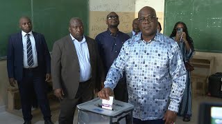 DR Congo President Felix Tshisekedi votes in Kinshasa  AFP [upl. by Oniratac]