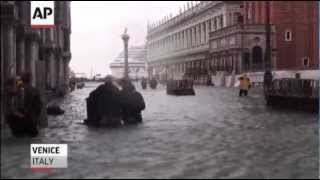 Raw Tourists Battle High Flood Waters in Venice [upl. by Ylsew]