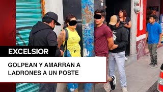 Pobladores golpean y amarran a un poste a pareja de ladrones [upl. by Lorsung]