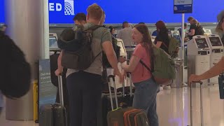 Big lines at Denver International Airport after global computer outage [upl. by Eillehs]