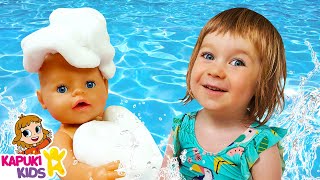 Kids play dolls amp feeding Baby Annabell doll at the beach  Baby doll bath time amp Family fun video [upl. by Alletnahs]