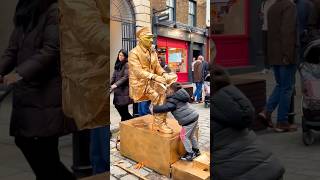 How London Levitating Goldman Statue is rewarding his top little fanslivingstatue floating art [upl. by Ahsiekan]