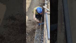 Worker clean soil on corbel to top up mortar [upl. by Peadar607]