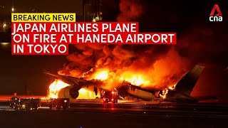 Japan Airlines plane catches fire at Tokyos Haneda airport [upl. by Lienahs370]