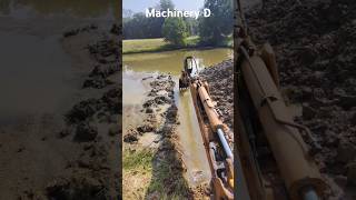 Draining a pond backhoe case580 ponds [upl. by Jovia]