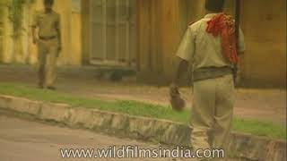 Policeman brushes his teeth rifle on shoulder passes Tea stall in 1990s Lucknow [upl. by Yengac]