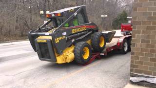 Loading Skidsteer onto lowboy trailer [upl. by Aicinat]