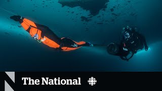 TheMoment a diver broke the world record with a 140 m swim under ice [upl. by Worrell975]