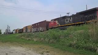 Canadian National Speeds Through Onarga IL with a Ballast Cleaner in Tow [upl. by Dix]