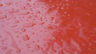 Raindrops scattered across smooth red iron surface [upl. by Wendelina]