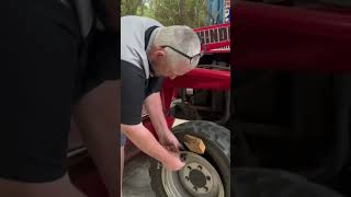 Replace a valve stem on a tractor tire [upl. by Ashleigh257]