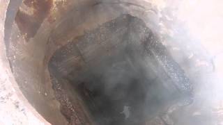 Steam Leaking Out Of A Manhole From Underground Pipeline [upl. by Anila]