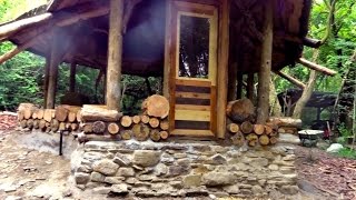 Off grid roundhouse build part 12 cordwood walls lime plaster and flooring [upl. by Slrahc]