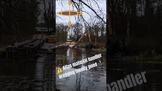 Dredging muddy pond with ATLAS Material handler shorts [upl. by Ocsirf]