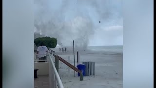 WATCH Waterspout comes ashore chases Florida beachgoers in viral video [upl. by Clementina]