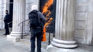 Just Stop Oil supporters paint London buildings orange [upl. by Oniger]