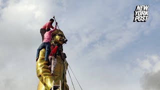 Bangladeshi protesters destroy statue of ousted PM Hasinas father with sledgehammer [upl. by Nisay]