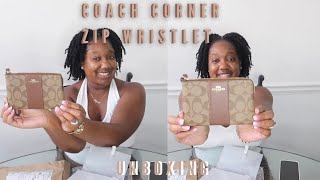 UNBOXING COACH CORNER ZIP WRISTLET IN SIGNATURE CANVAS GOLD KHAKI SADDLE 2 [upl. by Huoh]