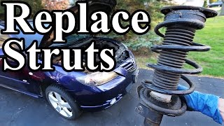 How to Replace Struts in your Car or Truck [upl. by Llewej]