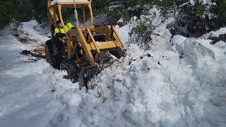 Plowing Snow with an old Backhoe [upl. by Aiyekal360]