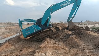 Canal work of excavator kobelco and Excavator cat [upl. by Allsopp]