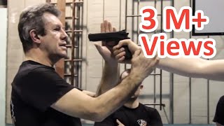 KRAV MAGA TRAINING • The Fastest gun disarm Tutorial [upl. by Karlin123]