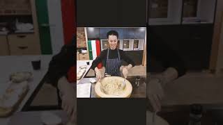 Chef Rafaela Neves mixing up a fresh set of housemade fusilli pasta in a giant cheese wheel [upl. by Burack]