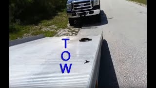 Using a Roll back Flat bed Tow Truck Moving Repo cars Wheel lift [upl. by Des]