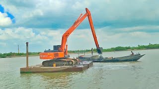 Excavator working on Bod loding TATA HITACHI EX215 Super long reach on pontoon [upl. by Ellevart]