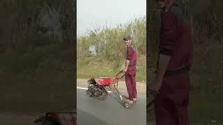 Man Amuses Passerby While Riding Makeshift Engine Powered Wheelbarrow  1194592 [upl. by Admana]