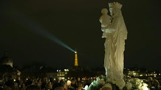 Paris NotreDames replica statue returns in a torchlight procession  AFP [upl. by Asital]