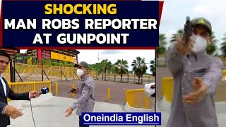 Man robs news reporter at gunpoint during live broadcast Watch video  Oneindia News [upl. by Lunt]