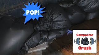 Trash compactor crushing and popping black bags [upl. by Ednalrym]