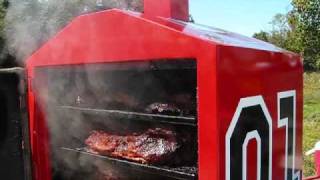 BBQ Smoker loaded with 18 full sized beef briskets Cooking with Wine and the BBQ Vault [upl. by Hcir]