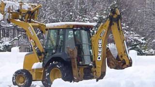 John Deere backhoe loader clearing snow [upl. by Ansaev]