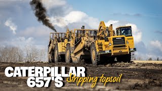 Stripping topsoil with the biggest scrapers they make CATERPILLAR 657s [upl. by Nariko]