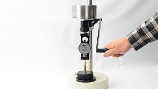 RX1600C with OS1 Durometer test stand measuring hockey puck hardness [upl. by Ewnihc]