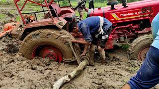 How to get tractor out of mudThis tractor stuck for 4 hourstractor mud rescuewill come out or not [upl. by Aihsel]