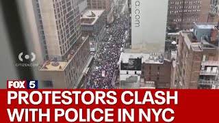 Protestors clash with police in Times Square [upl. by Eilojne]