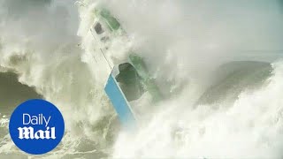 Dramatic moment tiny boat is capsized by huge wave in Indonesia [upl. by Prinz]