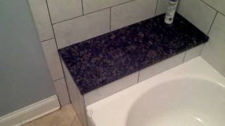 How to install a granite bench and tile tub surround [upl. by Macdougall]