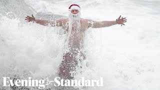 Plucky swimmers start Christmas Day with a dip in the sea [upl. by Rey]