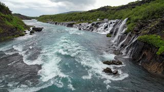 Flying in the rain at Hraunfossar Barnafoss Waterfalls in Iceland [upl. by Devondra]