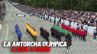 La antorcha olímpica llega a París en el día de la Fiesta Nacional en Francia I MARCA [upl. by Halle]